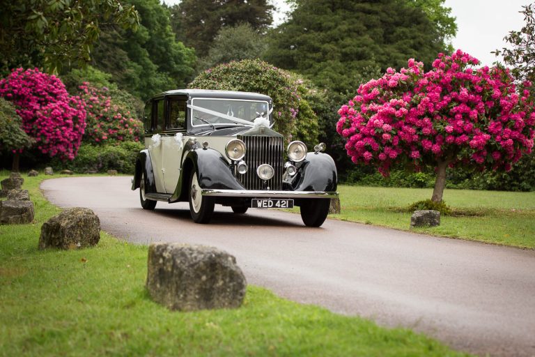 Classic vintage car on garden path by Southampton wedding photographer John Watson