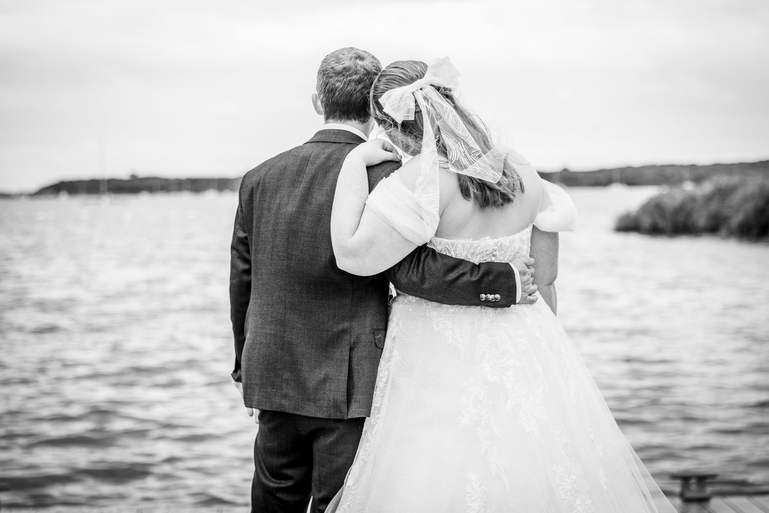 Bride and groom by the lake captured by Southampton wedding photographer John Watson