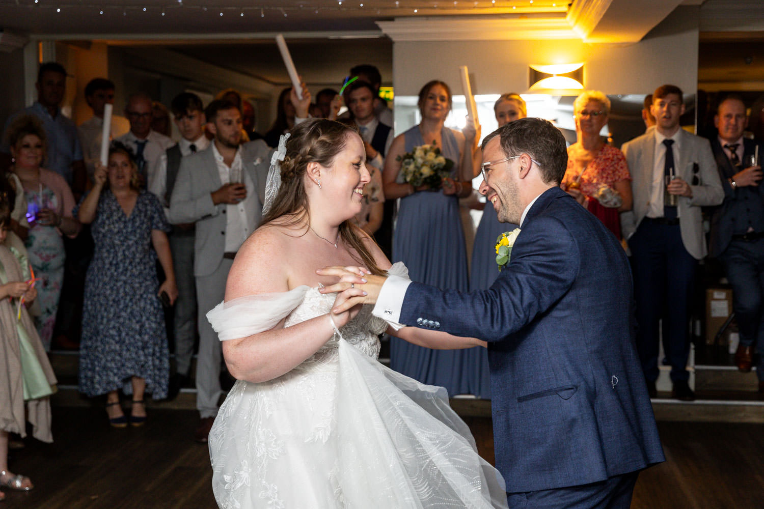 Bride and groom sharing first dance at wedding reception by Southampton wedding photographer John Watson
