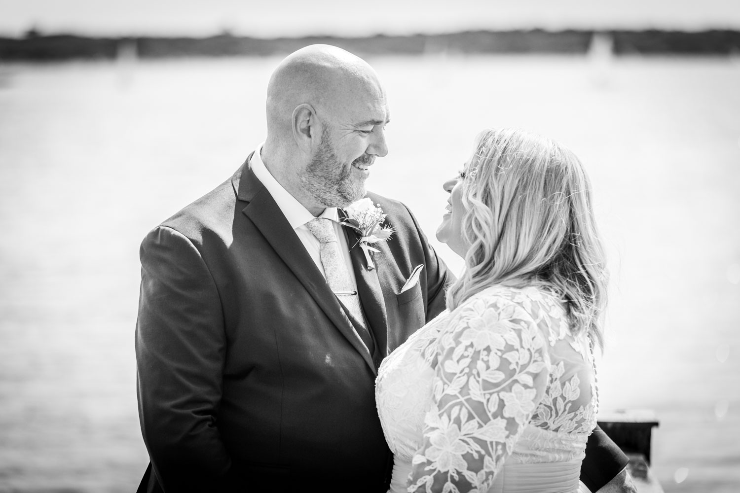 Bride and groom by the water on their wedding day by Southampton wedding photographer John Watson
