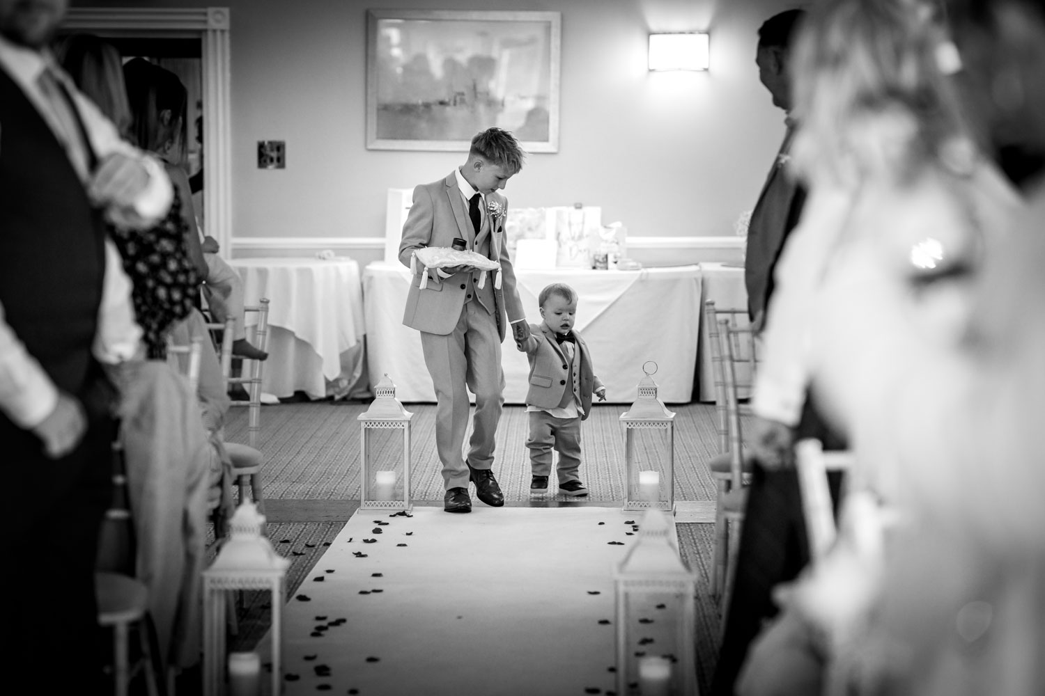 Young ring bearers walking down the aisle by Southampton wedding photographer John Watson