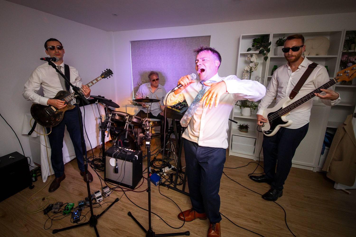 Live band performing at wedding reception by Southampton wedding photographer John Watson