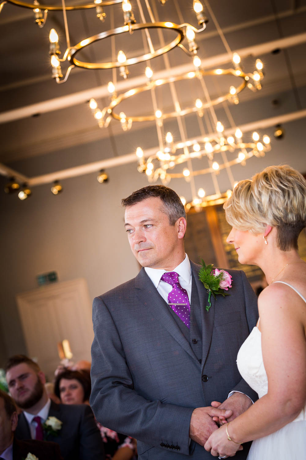 Elegant couple in wedding ceremony by Southampton wedding photographer John Watson