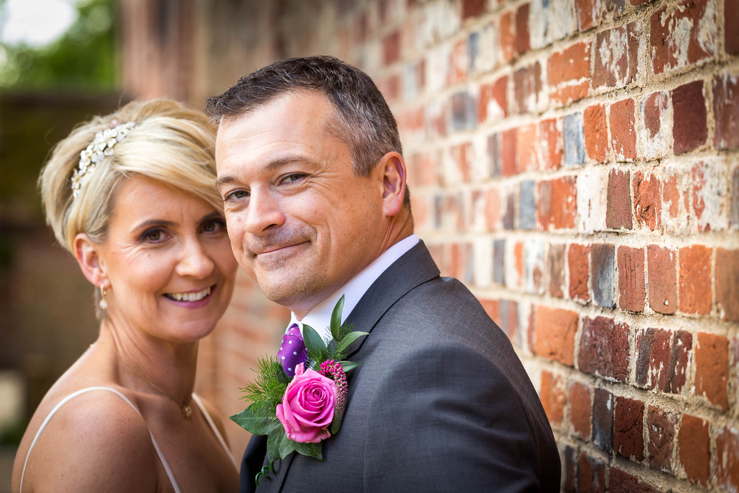 Happy couple on their wedding day by Southampton wedding photographer John Watson