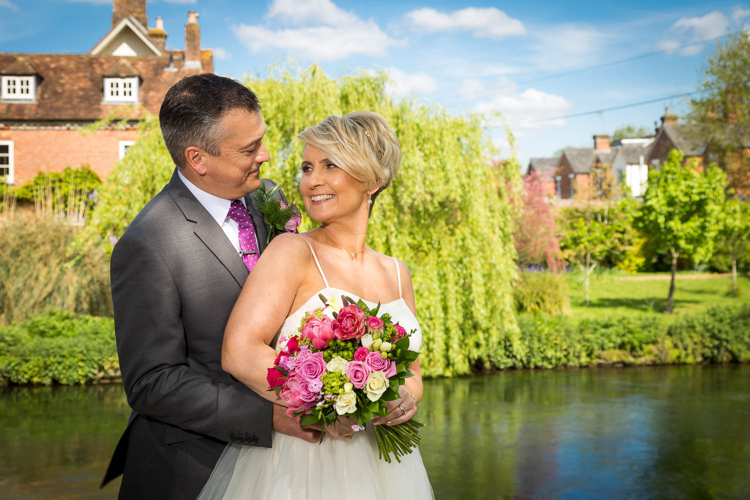 Bride and groom in garden setting by Southampton wedding photographer John Watson