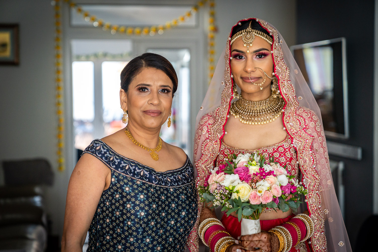 Bride and mother in elegant attire by Southampton wedding photographer John Watson