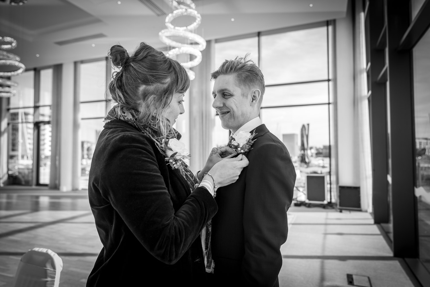 Couple shares a joyful moment at wedding venue by Southampton wedding photographer John Watson