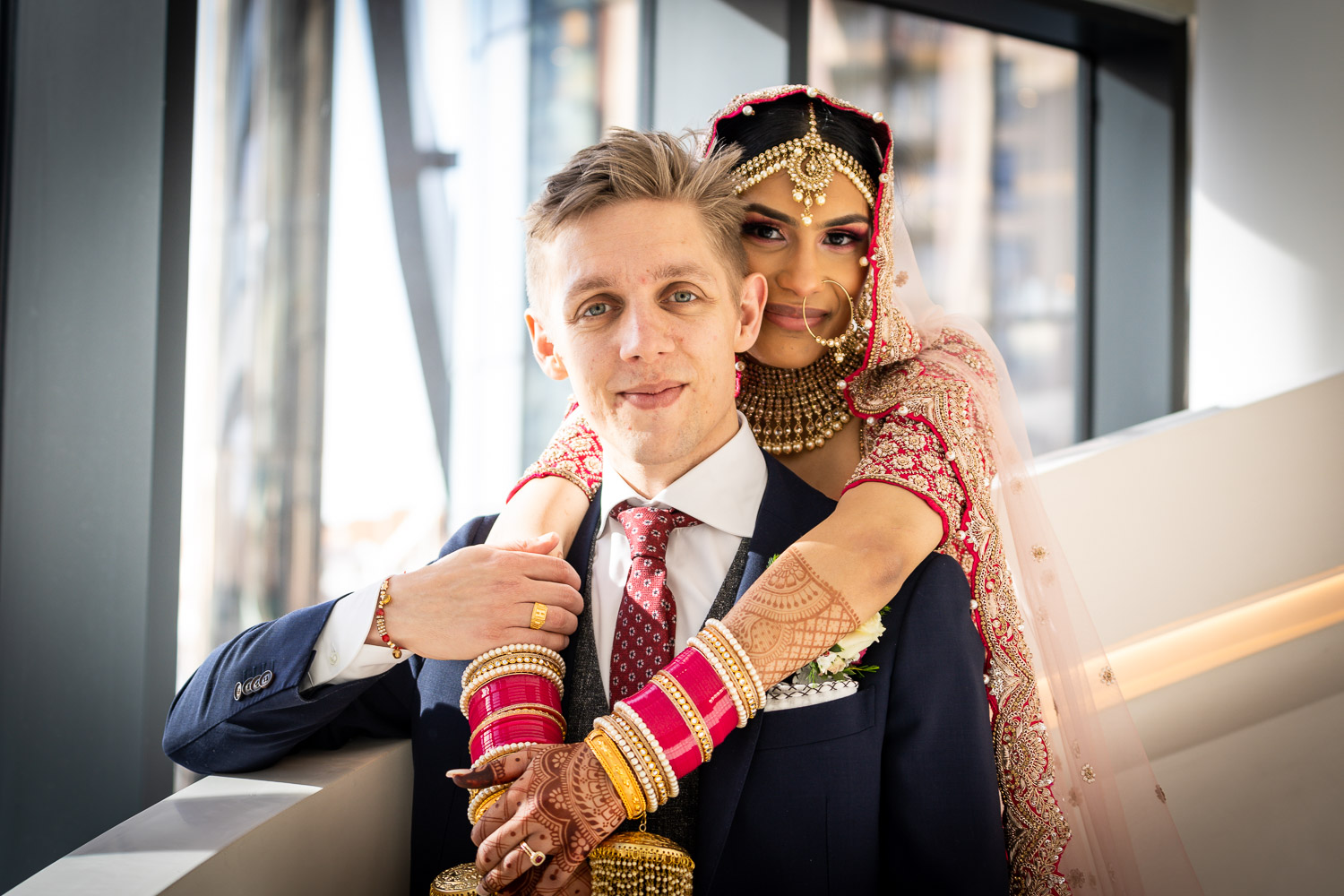 Bride and groom in elegant attire by Southampton wedding photographer John Watson