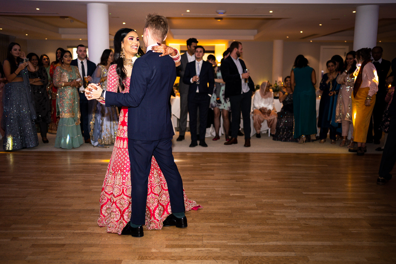 Bride and groom share first dance at wedding reception by Southampton wedding photographer John Watson