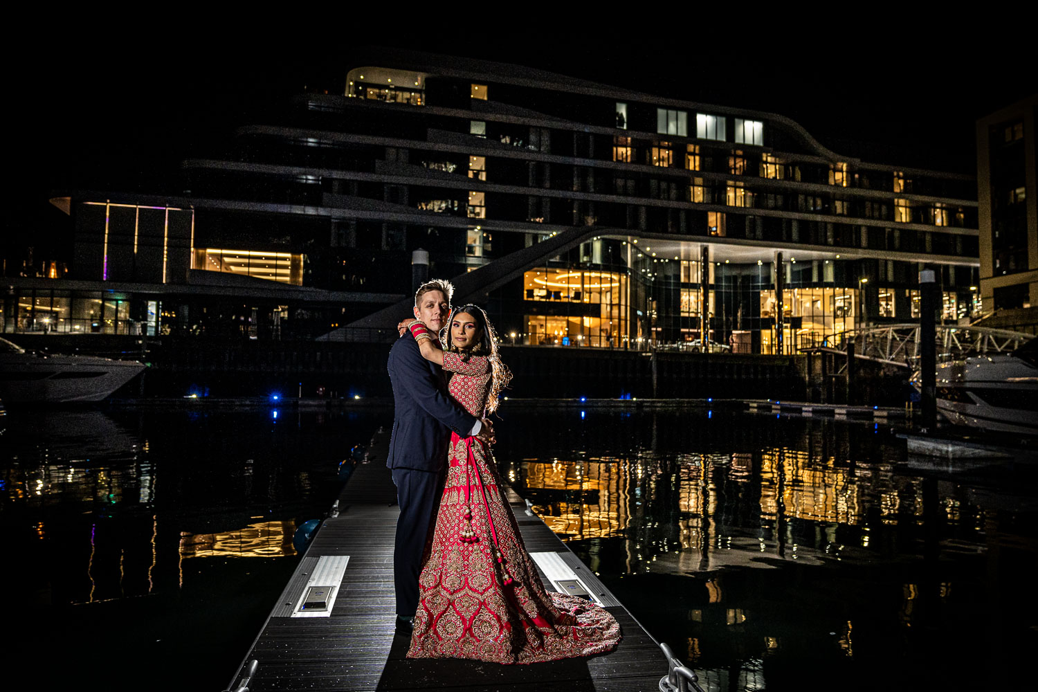Nighttime couple photoshoot by marina lights by Southampton wedding photographer John Watson
