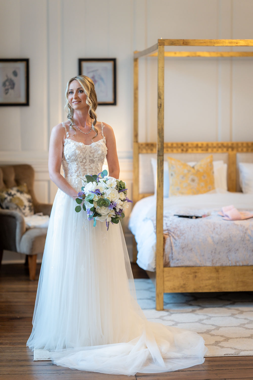 Bridal portrait with floral bouquet in elegant room by Southampton wedding photographer John Watson
