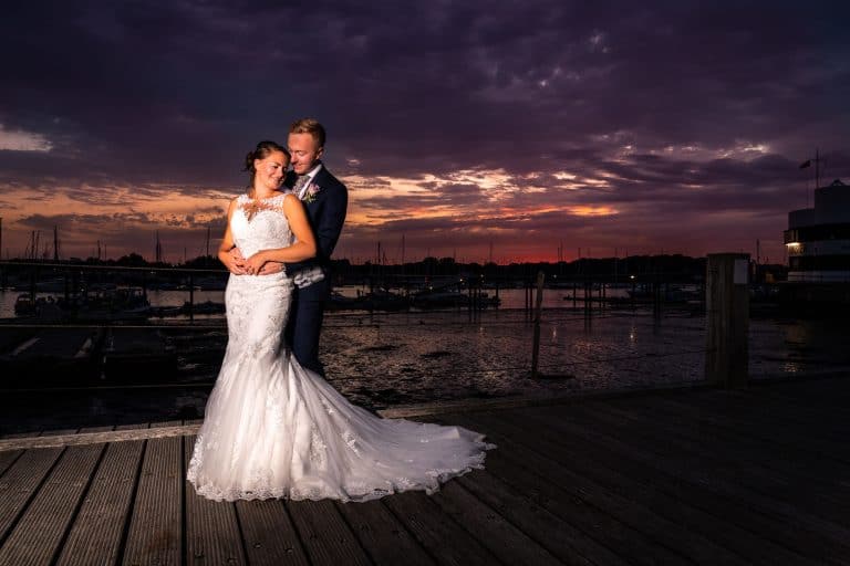 Bride and groom at sunset by Southampton wedding photographer John Watson