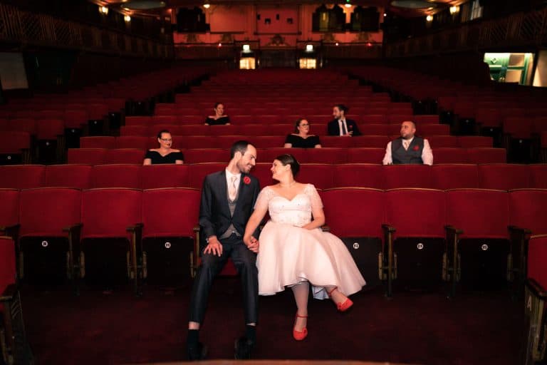 Bride and groom in theatre setting by Southampton wedding photographer John Watson
