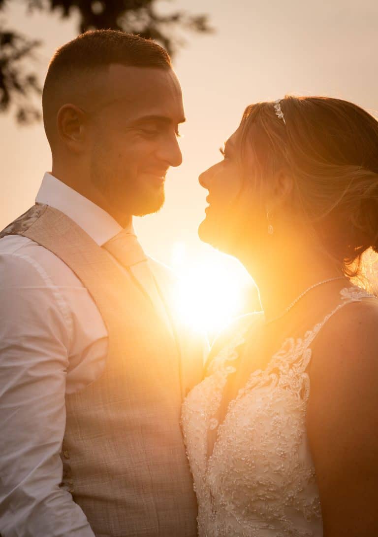 Sunset wedding couple gazing lovingly by Southampton wedding photographer John Watson