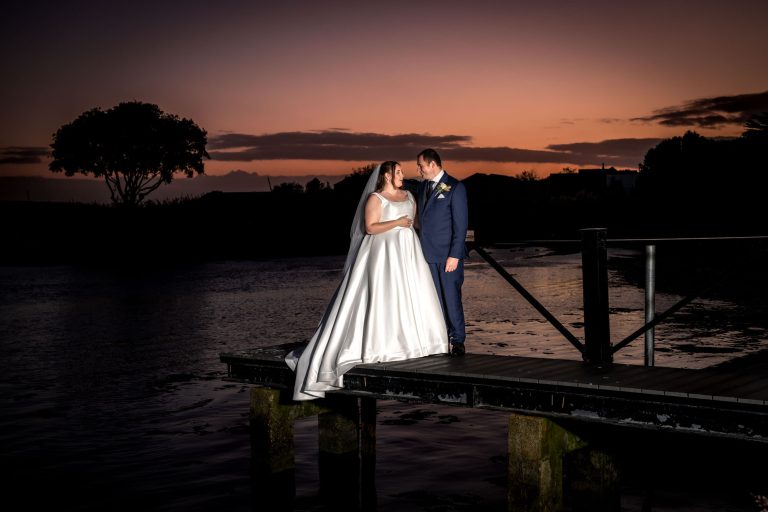 Bride and groom at sunset by Southampton wedding photographer John Watson