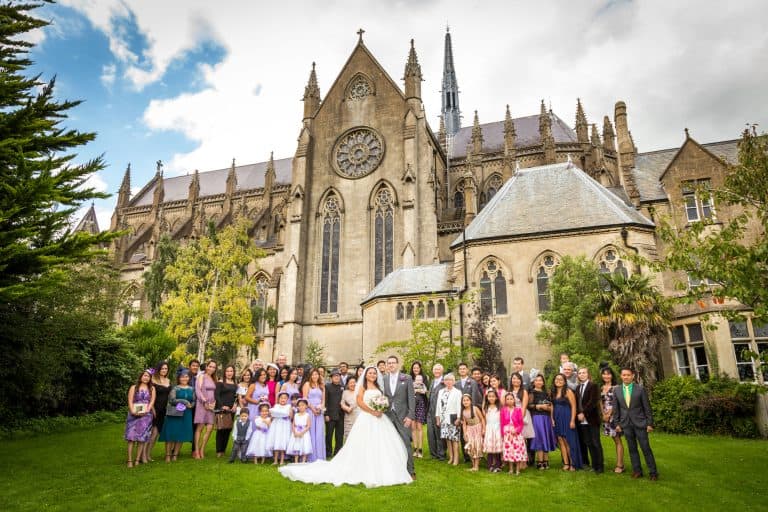 Wedding group at a historic church by Southampton wedding photographer John Watson