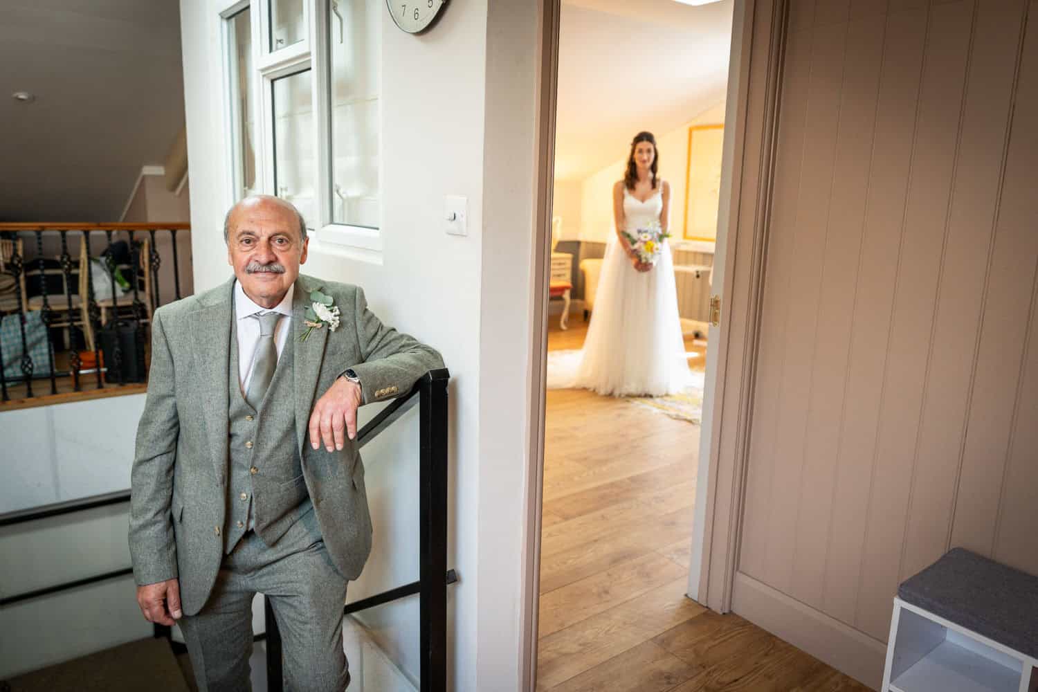 Father and bride getting ready for wedding by Southampton wedding photographer John Watson