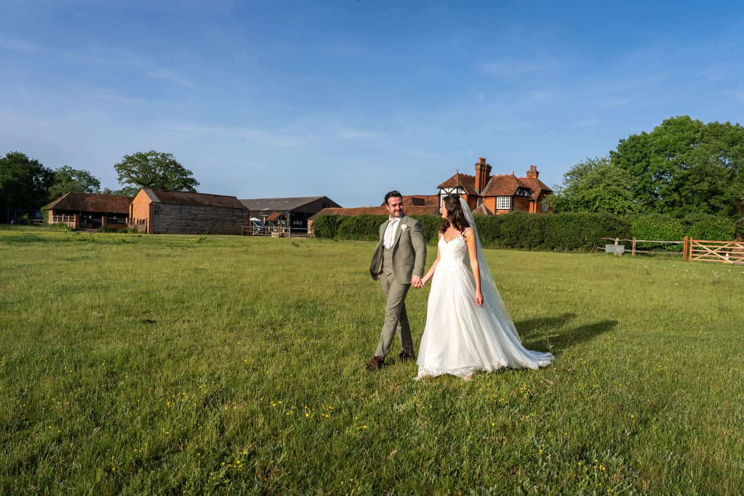 Bride and groom in countryside setting by Southampton wedding photographer John Watson