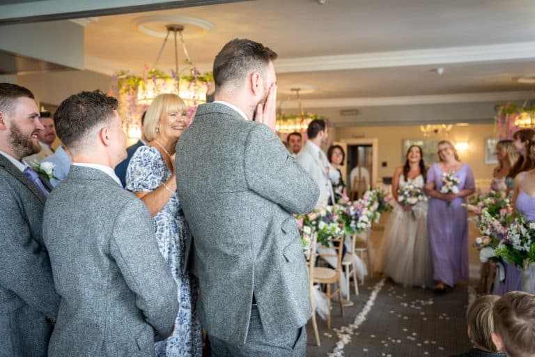 Groom emotional as bride walks down aisle by Southampton wedding photographer John Watson