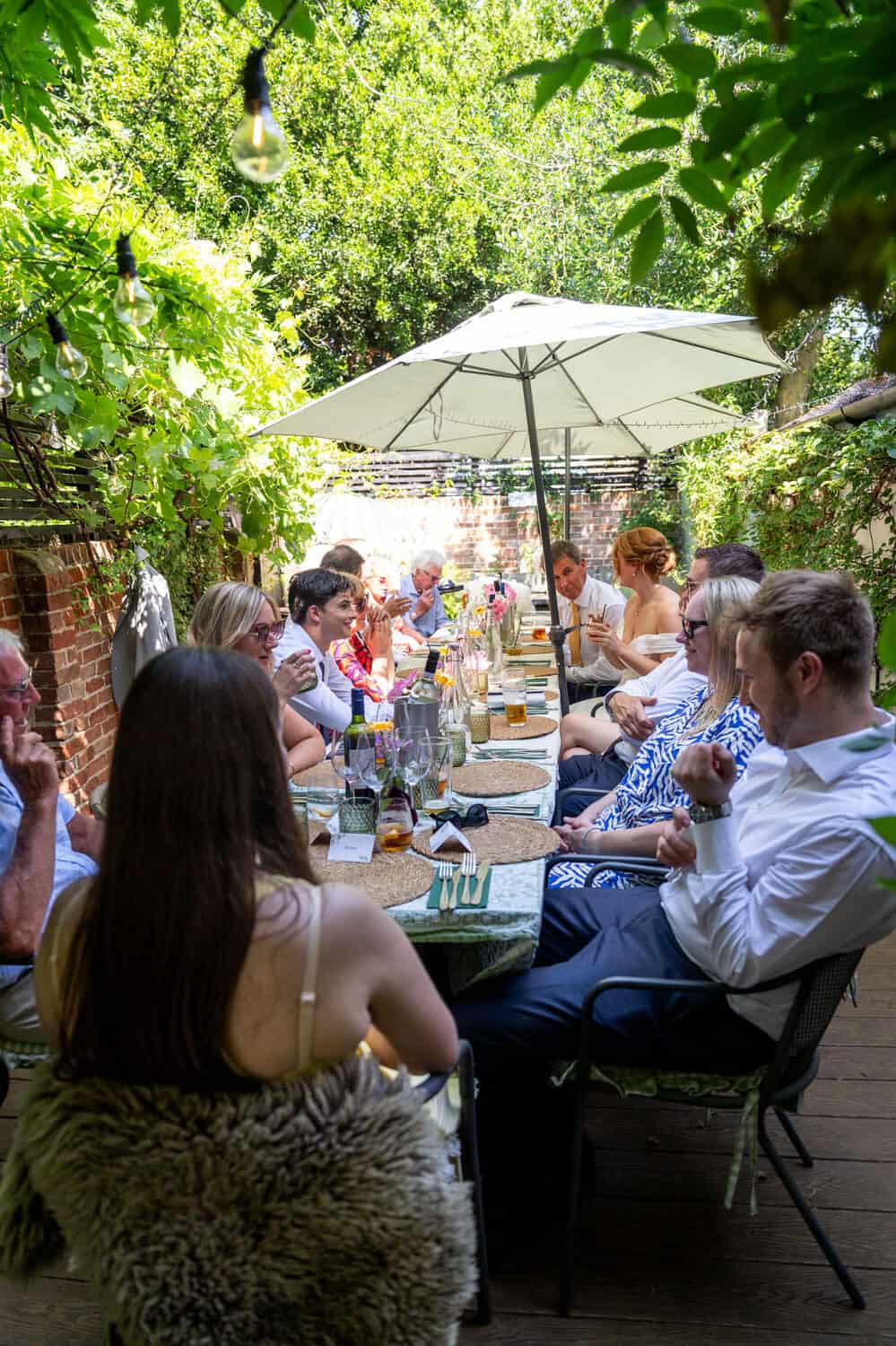 Outdoor wedding reception lunch in garden by Southampton wedding photographer John Watson