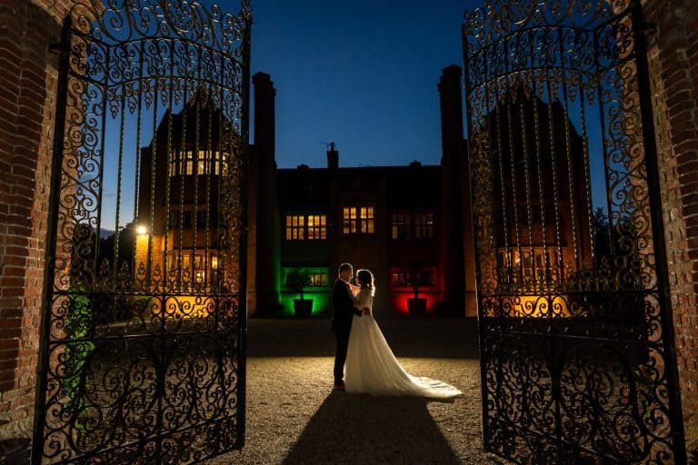 Bride and groom embrace at sunset by Southampton wedding photographer John Watson